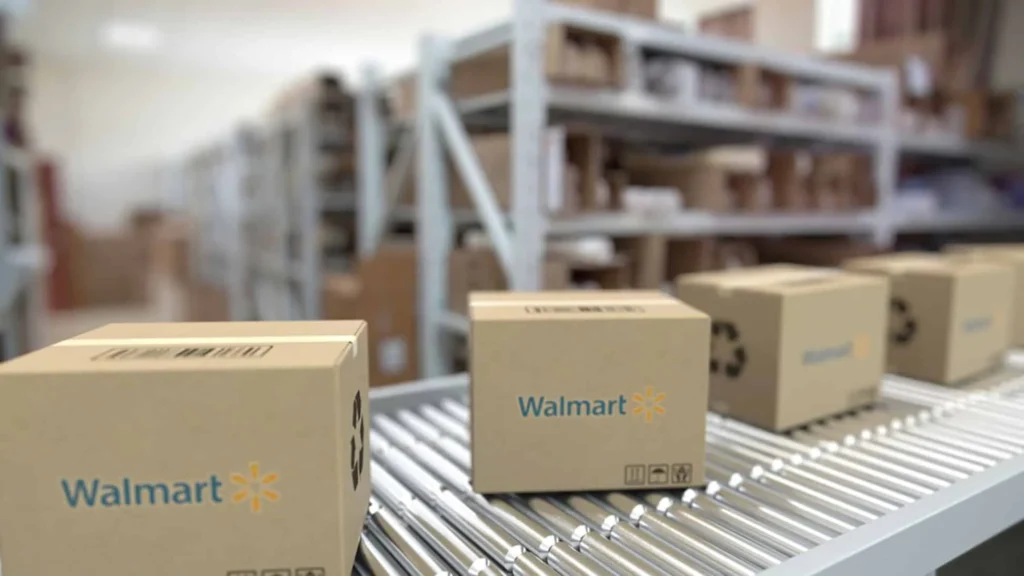 Walmart branded boxes moving on automated conveyor system in distribution warehouse facility