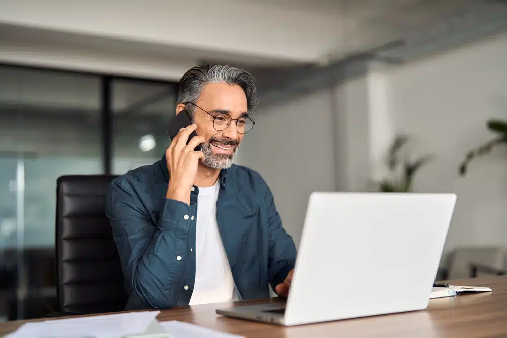 smiling male professional using edi setup