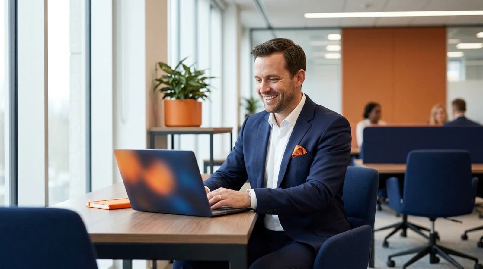 a man in suit looking at his computer