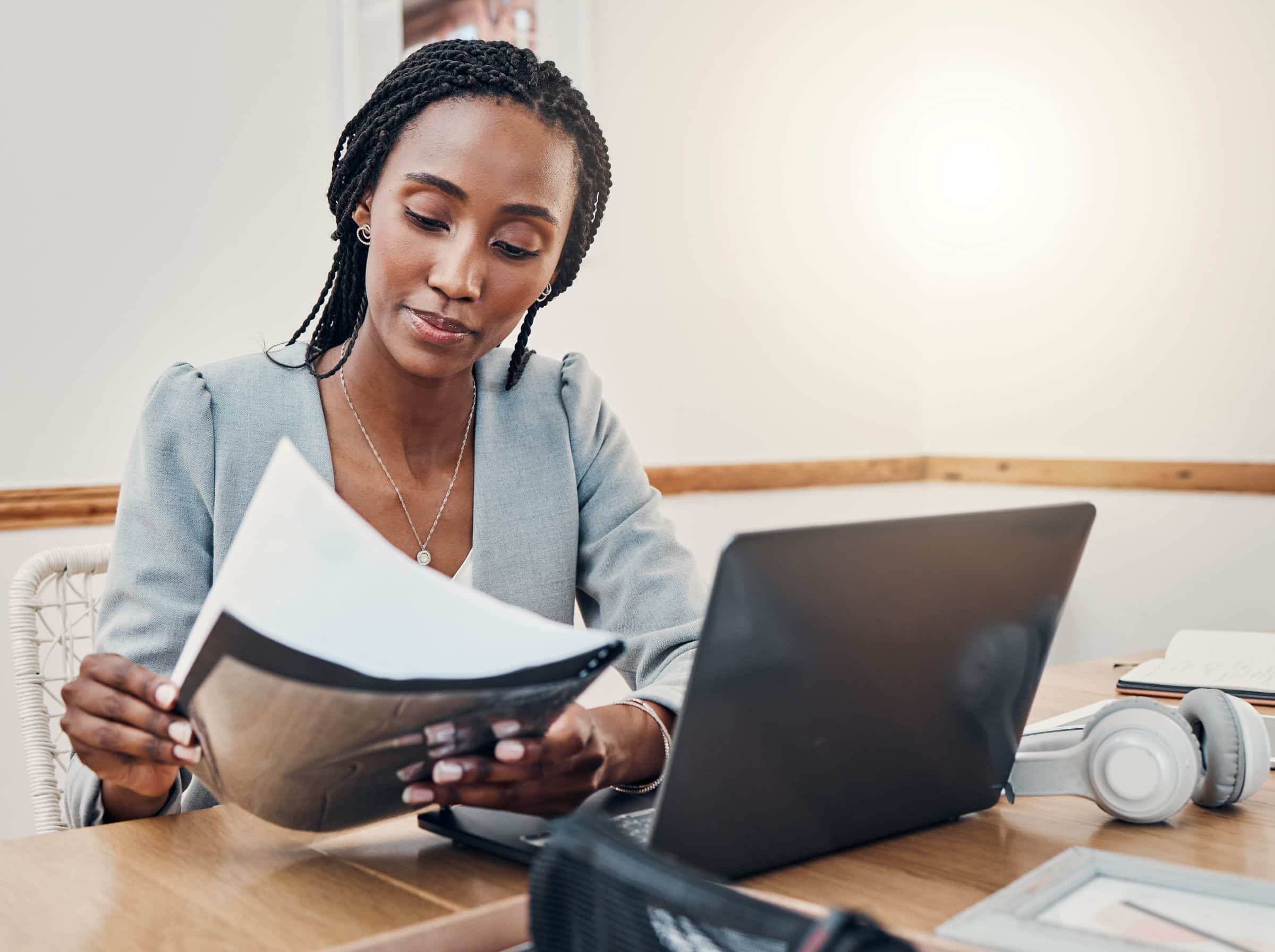 Black woman reviewing business documents for a small business
