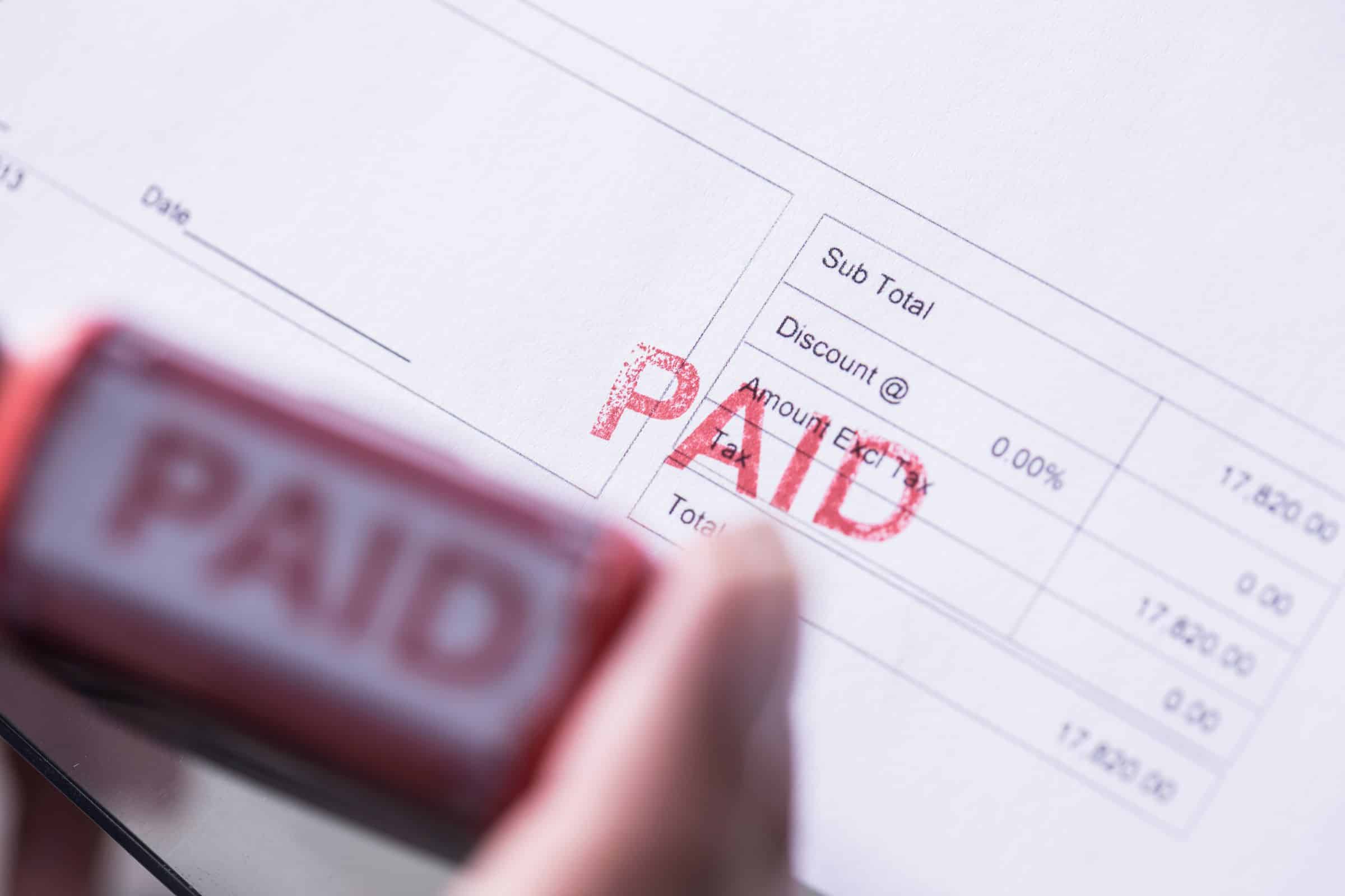 Red PAID stamp on a document