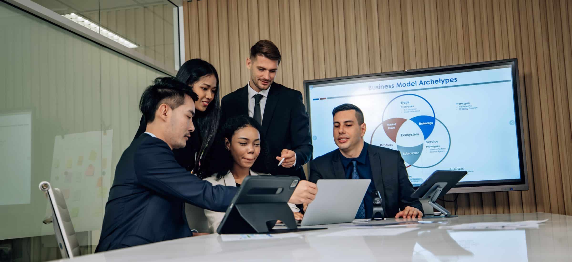 Diverse team collaborating on sales KPIs