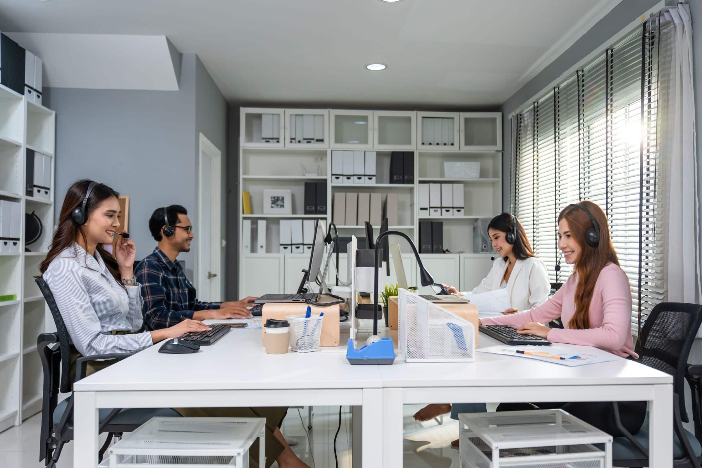 Group of Asian businessman and businesswoman working in cubicles