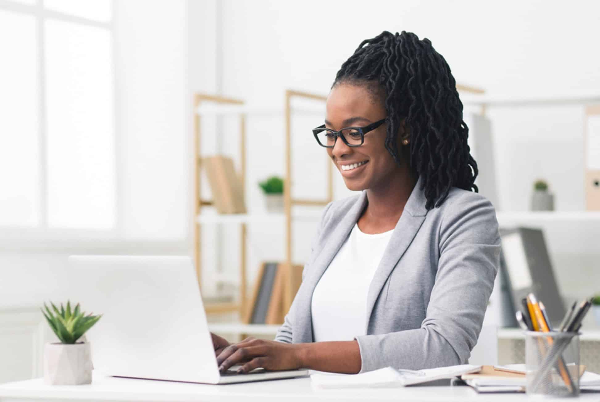 Woman typing on a computer