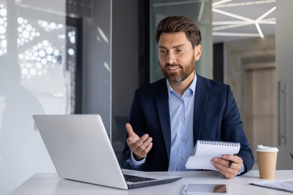 Businessman setting up retail EDI financial system