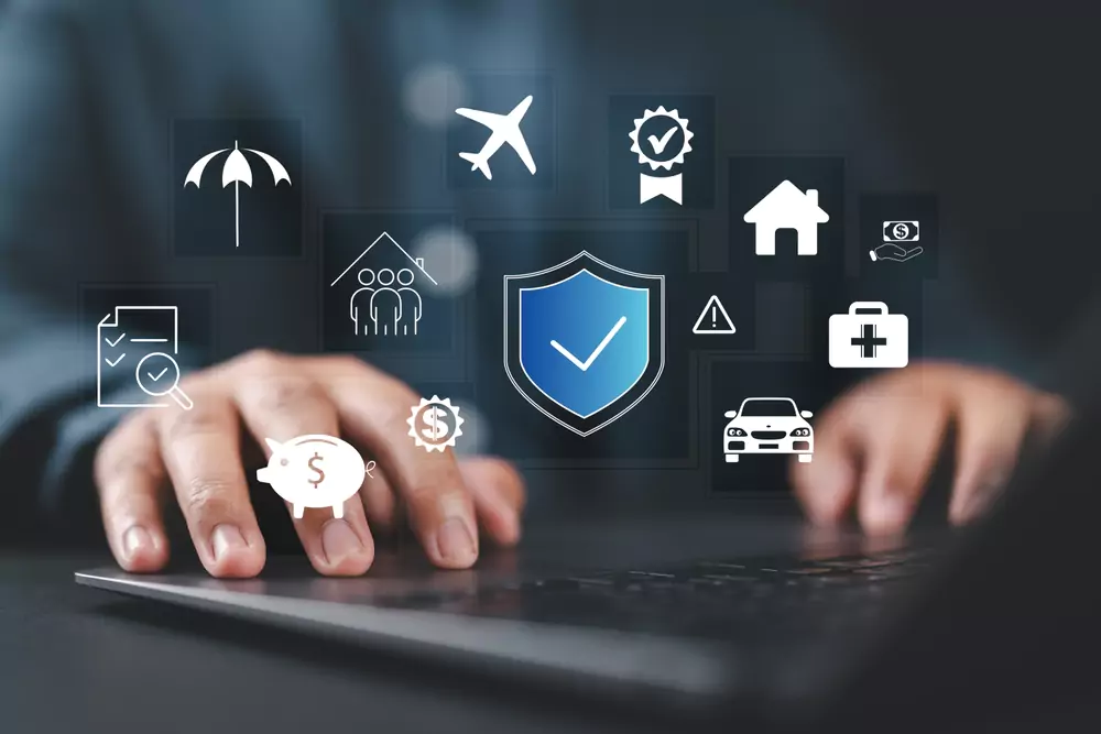 Laptop overlaid with icons representing different insurance policies