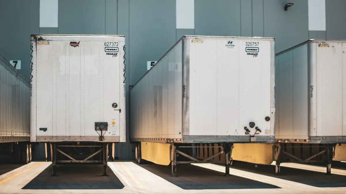 Semi-trailers backed up to warehouse loading docks