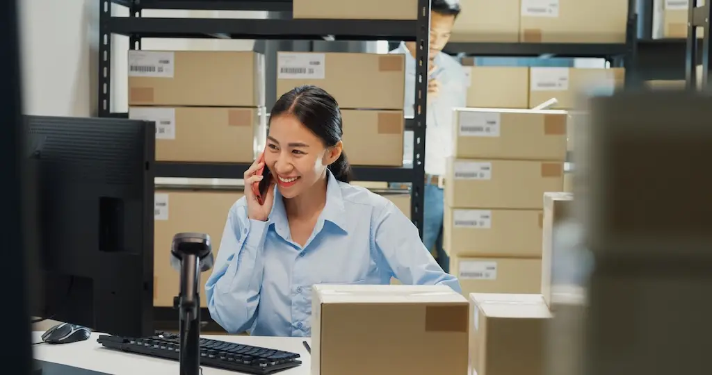 smiling female logistics manager using asn